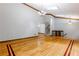 Bright living room with skylights, hardwood flooring, and a staircase leading to the upper level at 288 Shire Way, Lawrenceville, GA 30044