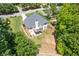 Aerial view of a home with a deck, patio, and a spacious backyard at 5791 Epping Ct, Douglasville, GA 30135