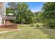 Expansive backyard featuring a deck, lush greenery, and privacy at 5791 Epping Ct, Douglasville, GA 30135
