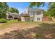 Spacious backyard with a deck, mature trees, and a level lawn at 5791 Epping Ct, Douglasville, GA 30135
