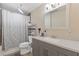 Bathroom features a shower with gray and white curtain and a modern vanity at 5791 Epping Ct, Douglasville, GA 30135