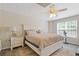 Bedroom with a neutral color scheme, ceiling fan, and window at 5791 Epping Ct, Douglasville, GA 30135