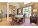 Formal dining room features hardwood floors, chandelier, and view of the home's entrance at 5791 Epping Ct, Douglasville, GA 30135