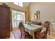 Formal dining room with a traditional chandelier, hardwood floors, and ample natural light at 5791 Epping Ct, Douglasville, GA 30135