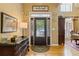 Elegant foyer with hardwood floors, decorative front door, and natural light at 5791 Epping Ct, Douglasville, GA 30135