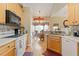 Bright eat-in kitchen featuring modern appliances, wooden cabinets, and stylish decor at 5791 Epping Ct, Douglasville, GA 30135