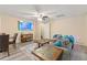 A living room featuring a grey sofa and furnishings, along with a television at 5791 Epping Ct, Douglasville, GA 30135