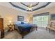 Comfortable main bedroom with a large bed, coffered ceiling, and a sunlit window at 5791 Epping Ct, Douglasville, GA 30135