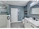 Modern bathroom with marble vanity, walk-in shower and gray tile flooring at 950 W Peachtree Nw St # 911, Atlanta, GA 30309