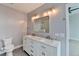 Bright bathroom features double sinks, marble counters, and a toilet at 950 W Peachtree Nw St # 911, Atlanta, GA 30309
