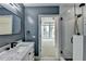 Modern bathroom with walk-in shower and marble vanity at 950 W Peachtree Nw St # 911, Atlanta, GA 30309