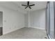 Neutral bedroom features light carpet and a ceiling fan at 950 W Peachtree Nw St # 911, Atlanta, GA 30309