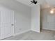 Neutral-toned bedroom featuring a closet, ceiling fan and white trim at 950 W Peachtree Nw St # 911, Atlanta, GA 30309