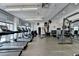 Well-equipped fitness center with treadmills, weights, and workout machines at 950 W Peachtree Nw St # 911, Atlanta, GA 30309