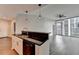 Contemporary kitchen with open concept layout including granite countertop island, modern lighting, and stainless appliances at 950 W Peachtree Nw St # 911, Atlanta, GA 30309