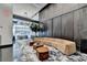 Modern lobby with a long curved beige sofa, hardwood tables and a high ceiling at 950 W Peachtree Nw St # 911, Atlanta, GA 30309
