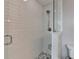 Shower stall features white subway tile and a glass door at 950 W Peachtree Nw St # 911, Atlanta, GA 30309