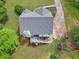Aerial shot of a home with deck, well-manicured lawn, and lush landscaping at 100 Sydney Smt, Villa Rica, GA 30180
