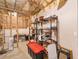 Unfinished basement showing insulation and shelving ready for storage solutions at 100 Sydney Smt, Villa Rica, GA 30180