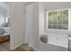 Bright bathroom featuring a soaking tub with window view and stylish fixtures at 100 Sydney Smt, Villa Rica, GA 30180