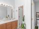Dual sink bathroom with a light wood vanity and a separate toilet room at 100 Sydney Smt, Villa Rica, GA 30180