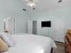 Airy bedroom showcasing a high ceiling, ensuite access, and a mounted television at 100 Sydney Smt, Villa Rica, GA 30180