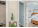 View from closet showing bedroom, featuring a cozy bed and wood floors at 100 Sydney Smt, Villa Rica, GA 30180