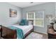 Cozy bedroom featuring a window and a decorative painting at 100 Sydney Smt, Villa Rica, GA 30180