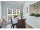 Bright dining room features a modern chandelier, with lots of natural light at 100 Sydney Smt, Villa Rica, GA 30180