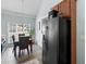 A modern kitchen with stainless steel appliances, leading into the dining area with a table at 100 Sydney Smt, Villa Rica, GA 30180