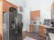 An efficient kitchen with wood cabinets, stainless steel appliances and tile countertops at 100 Sydney Smt, Villa Rica, GA 30180
