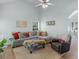 A spacious living room featuring vaulted ceilings, comfortable seating, and neutral paint at 100 Sydney Smt, Villa Rica, GA 30180