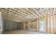 Bright, unfinished basement with walkout door and window framing, ready for transformation at 10350 Alvin Rd, Johns Creek, GA 30022