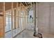 Unfinished basement featuring framed walls, concrete foundation, and modern utilities for future customization at 10350 Alvin Rd, Johns Creek, GA 30022