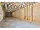 Unfinished basement with wood framing, concrete floors, and exposed ceiling, ready for customization at 10350 Alvin Rd, Johns Creek, GA 30022