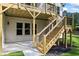 The home has a walkout basement with concrete patio and stairs to the main deck at 10350 Alvin Rd, Johns Creek, GA 30022