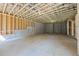 Spacious unfinished basement with concrete floor, framed walls and exposed ceiling joists ready to be renovated at 10350 Alvin Rd, Johns Creek, GA 30022