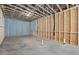 Unfinished basement featuring concrete floors, framed walls, and visible utilities for future customization at 10350 Alvin Rd, Johns Creek, GA 30022