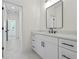 Bathroom with a white vanity, black hardware, and marble flooring, creating a modern aesthetic at 10350 Alvin Rd, Johns Creek, GA 30022