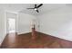 Primary bedroom showcasing hardwood floors and connecting ensuite bathroom at 10350 Alvin Rd, Johns Creek, GA 30022