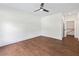Spacious bedroom with hardwood floors and ceiling fan at 10350 Alvin Rd, Johns Creek, GA 30022