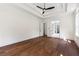 Large primary bedroom offers trey ceilings, fan, hardwood floors and access to primary bathroom at 10350 Alvin Rd, Johns Creek, GA 30022
