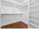Walk-in closet featuring ample shelf space and built-in organizers at 10350 Alvin Rd, Johns Creek, GA 30022