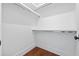 Bright walk-in closet with ample shelving and hanging space, perfect for organization at 10350 Alvin Rd, Johns Creek, GA 30022