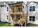 Beautiful back deck with ceiling fan and stairs to the lawn and walkout basement at 10350 Alvin Rd, Johns Creek, GA 30022