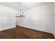 Elegant dining room with hardwood floors and modern chandelier lighting at 10350 Alvin Rd, Johns Creek, GA 30022