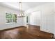 Bright dining room featuring a view of backyard through large window at 10350 Alvin Rd, Johns Creek, GA 30022