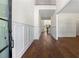 Welcoming foyer with hardwood floors, white wainscoting, and high ceilings at 10350 Alvin Rd, Johns Creek, GA 30022
