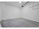 Clean garage space featuring concrete floors and a garage door opener at 10350 Alvin Rd, Johns Creek, GA 30022