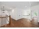 Hallway with hardwood floors and staircase at 10350 Alvin Rd, Johns Creek, GA 30022